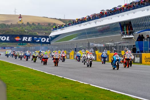 JEREZ DE LA FRONTERA, SPAIN - NOV 20: Motorbike competitors begin the 125GP - Moto3 race in the CEV Championship on November 20, 2011 in Jerez de la Frontera, Spain.