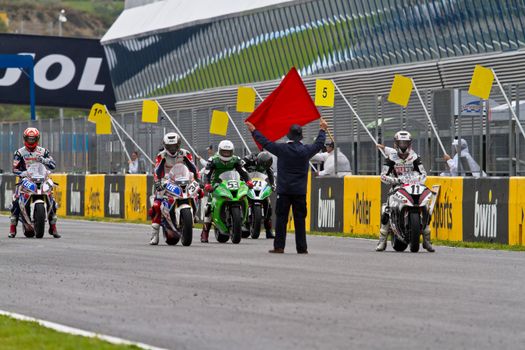 JEREZ DE LA FRONTERA, SPAIN - NOV 20: Motorbike competitors begin the Stock Extreme race in the CEV Championship  on November 20, 2011 in Jerez de la Frontera, Spain