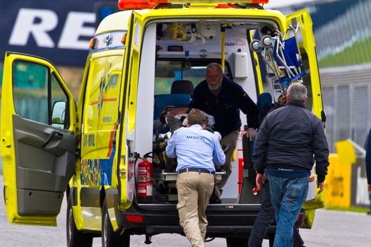 JEREZ DE LA FRONTERA, SPAIN - NOV 20: Medical team attending to Miguel Lopez after accident in the CEV Championship race on November 20, 2011 in Jerez de la Frontera, Spain