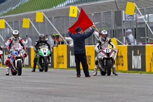JEREZ DE LA FRONTERA, SPAIN - NOV 20: Motorbike competitors begin the Stock Extreme race in the CEV Championship  on November 20, 2011 in Jerez de la Frontera, Spain