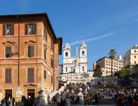 ROME, ITALY - JANUARY 27: Tourists sitting on Spanish Steps in Rome on January 27, 2013. The 138 steps were renovated in 1995