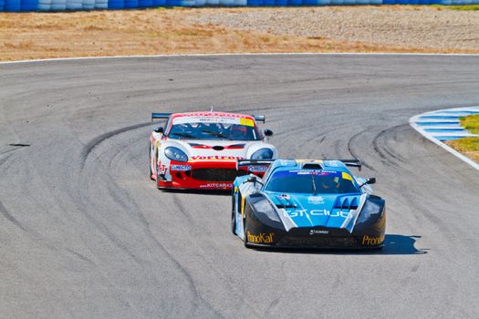 JEREZ DE LA FRONTERA, SPAIN - OCT 16: Ferran Monje(4) followed by Francesc Gutierrez(42)races on Iber GT championship on October 16 , 2011, in Jerez de la Frontera , Spain