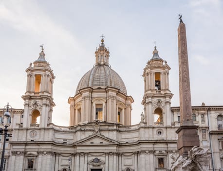 Sant Agnese in Agone lit up by setting sun in Piazza Navona