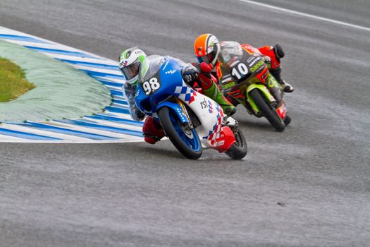 JEREZ DE LA FRONTERA, SPAIN - NOV 19: 125cc motorcyclist Ryan (98) and Migno (10 ) take a curve in the CEV Championship race on November 19, 2011 in Jerez de la Frontera, Spain.