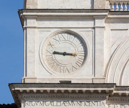 Detail of clock face on Trinita dei Monti church at top of Spanish Steps in Rome Italy
