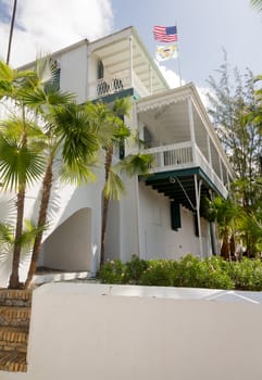 Old white painted house in the old town of Charlotte Amalie St Thomas USVI with ornate balcony