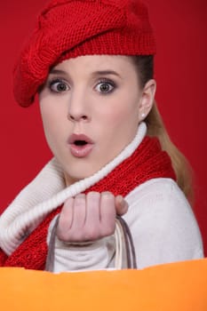 Shocked woman with shopping bags