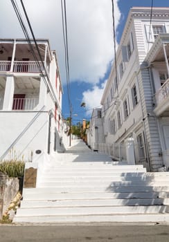 Series of white painted steps in staircase by side of Government house in Charlotte Amalie St Thomas
