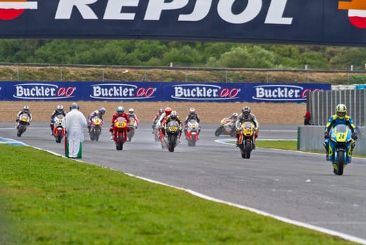 JEREZ DE LA FRONTERA, SPAIN - NOV 20: Motorbike competitors begin the Moto2 race in the CEV Championship on November 20, 2011 in Jerez de la Frontera, Spain.