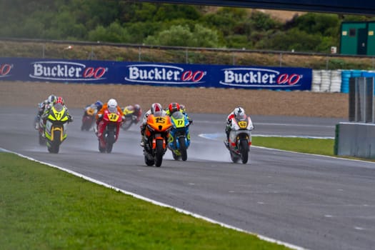 JEREZ DE LA FRONTERA, SPAIN - NOV 20: Motorbike competitors begin the Moto2 race in the CEV Championship on November 20, 2011 in Jerez de la Frontera, Spain.