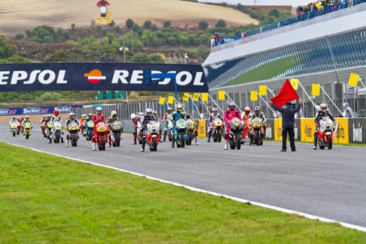 JEREZ DE LA FRONTERA, SPAIN - NOV 20: Motorbike competitors begin the Moto2 race in the CEV Championship on November 20, 2011 in Jerez de la Frontera, Spain.