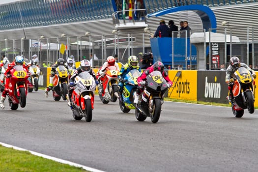 JEREZ DE LA FRONTERA, SPAIN - NOV 20: Motorbike competitors begin the Moto2 race in the CEV Championship on November 20, 2011 in Jerez de la Frontera, Spain.