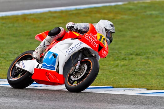 JEREZ DE LA FRONTERA, SPAIN - NOV 20: Moto2 motorcyclist Oscar Climent takes a curve in the CEV Championship race on November 20, 2011 in Jerez de la Frontera, Spain.