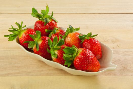Red strawberries on old wood table