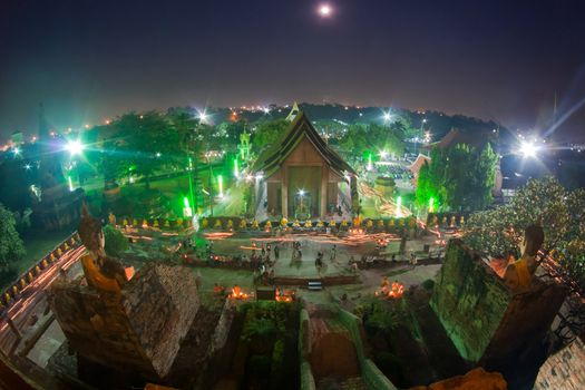 Religion Crowd walking with Candle Light around Temple in Makabucha day at Wat Yai Chaimongkol in Ayutthaya, Thailand