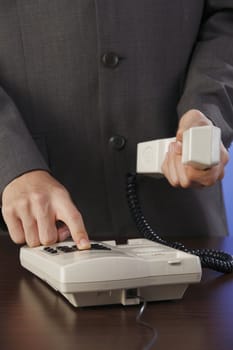 closeup of a man making phone call