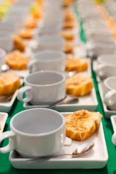 many fried Bread with dried shredded pork Thai dessert and white coffee cup