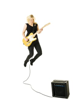Young woman playing electric guitar isolated on white background
