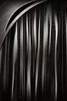 Metal on black silk curtain