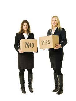 Businesswomen with yes- and no cardboard boxes isolated on white background