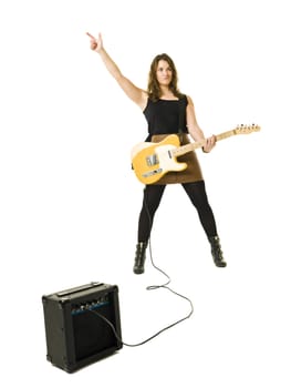 Young woman playing electric guitar isolated on white background