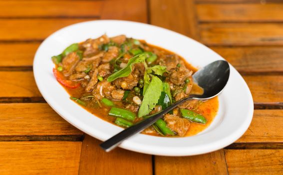 Fried chilli paste sauce with pork with herb thai food