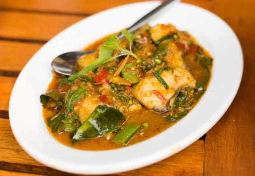 Fried chilli paste sauce with fish with herb thai food