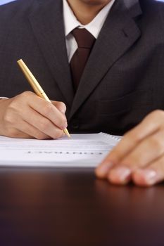 stock image of bussiness man signing contract