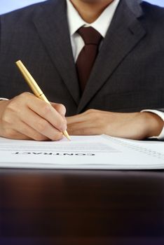 stock image of bussiness man signing contract