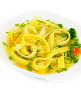 Chicken Noodle Soup with Parsley and Carrot in White Bowl isolated on white background