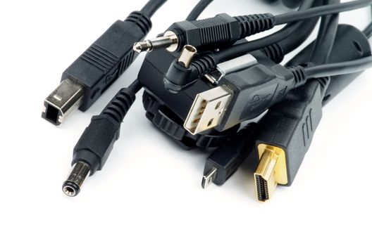 Heap of Plugs and Jacks with USB, HDMI, Sound and other Connectors isolated on white background