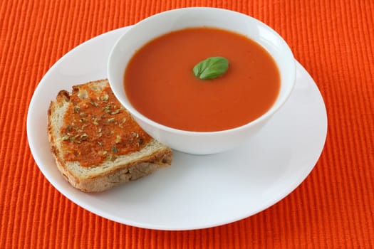 tomato soup with bread with peasto