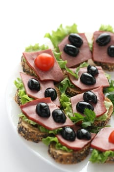 toasts with ham and olives