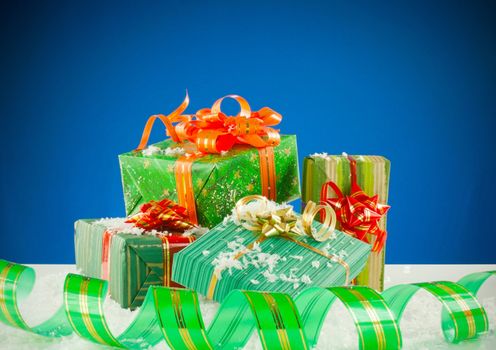 Christmas presents against blue background
