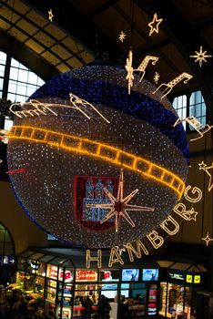 HAMBURG - DECEMBER 1, 2012: Beautiful Christmas decoration in the main station of Hamburg, Germany on December 1, 2012. The main station is the beginning of the famous Hamburg Christmas market located around the town hall and is a popular tourist attraction due to its gorgeous decorated stands.
