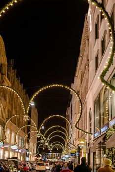 HAMBURG - DECEMBER 1 2012: People visit traditional Christmas decorated shopping area Neuer Wall in Hamburg, Germany on December 1, 2012. The street Neuer Wall was founded 1707 and is today housing exclusive shops – it is counted amongst the 10 most luxurious shopping streets in Europe.