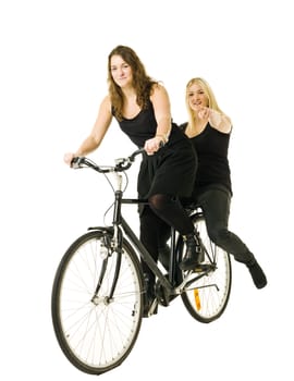 Two women on a bicycle isolated on white background
