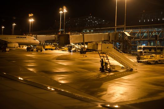 STUTTGART - DECEMBER 2, 2012: A plane is approaching the airport on the evening of on December 2, 2012 in Stuttgart, Germany. Stuttgart Flughafen is amongst the largest airports in Germany, serving almost 10 million passengers per year.