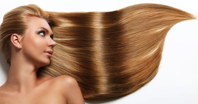 Caucasian woman with long beautiful blond hair isolated over white background