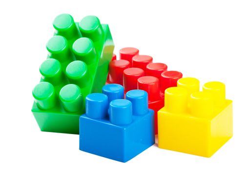 Colorful plastick building blocks isolated over white background