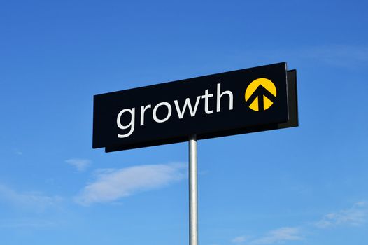 Street sign with upward arrow reading "growth"