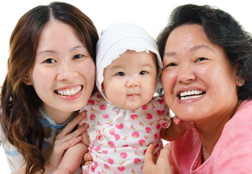 Happy Asian family isolated on white. Three generations Asian family, grandmother, mother and granddaughter.