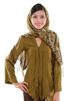 Portrait of a young attractive Southeast Asian muslim woman standing isolated on white background