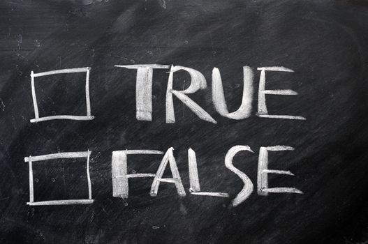 True and false check boxes written with chalk on a blackboard