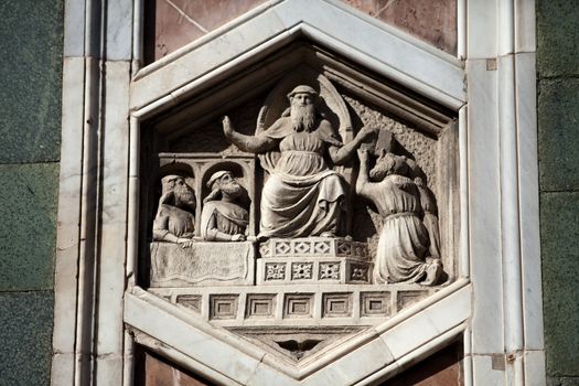 Florence - The hexagonal Relief on the Giottos' Campanile.The hexagonal panels on the lower level depict the history of mankind, inspired by Genesis.