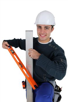 Worker with level spirit on white background