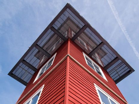 Watchtower facing blue sky down to up perspective