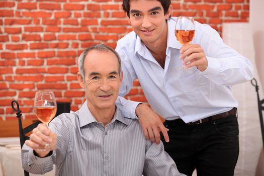 Men raising their glasses in a toast