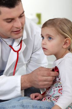 A doctor with a little girl.