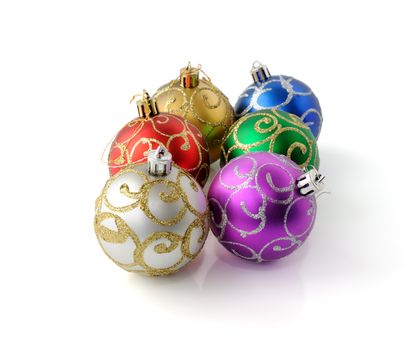 Christmas balls in different colors on a white background